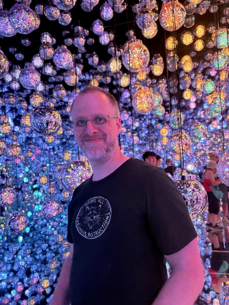 A man at teamLab Borderless Tokyo