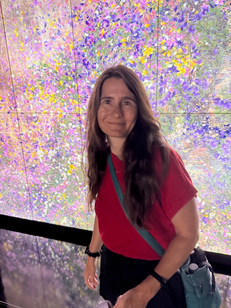 A woman at teamLab Borderless Tokyo